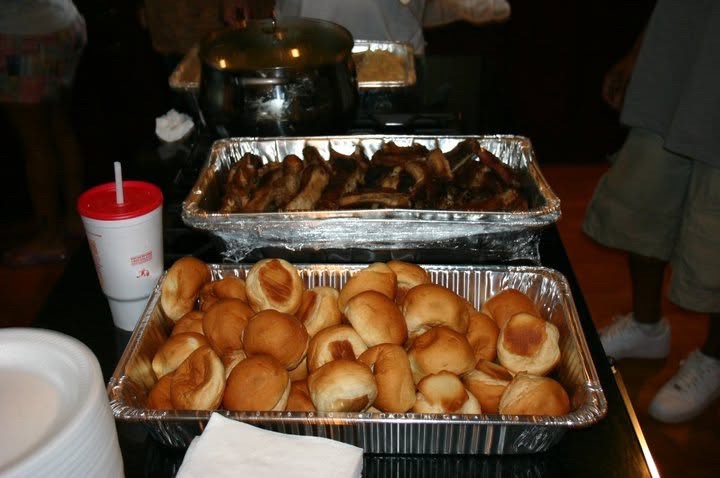 Trays of rolls and ribs on the reunion buffet